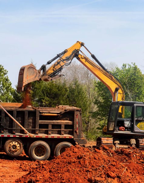 Heavy machinery is actively moving soil at construction site-img