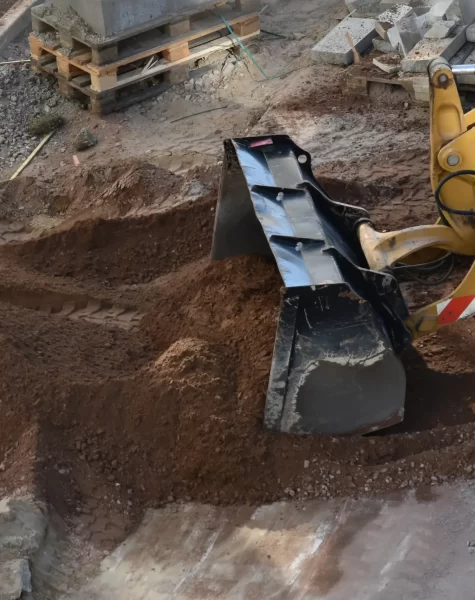 yellow-excavator-moving-soil-at-construction-site